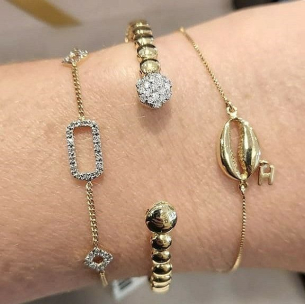 Pulseira feminina vazada em Ouro Amarelo 18K com Diamantes 